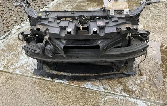 Radiator support slam panel