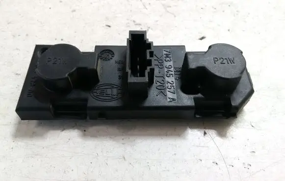 Tail light bulb cover holder