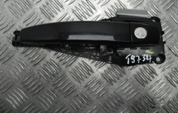 Opel Astra J Front door exterior handle 14095201 T9734