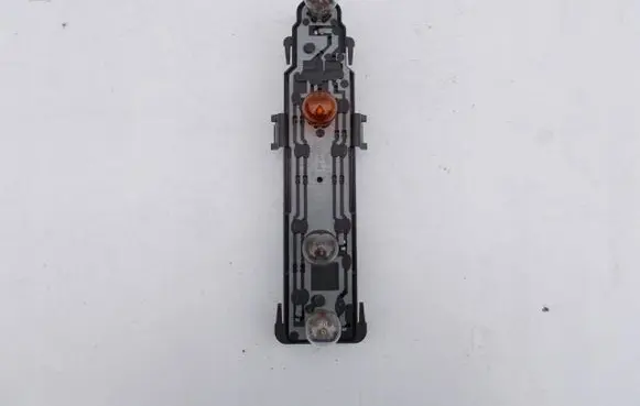 Tail light bulb cover holder