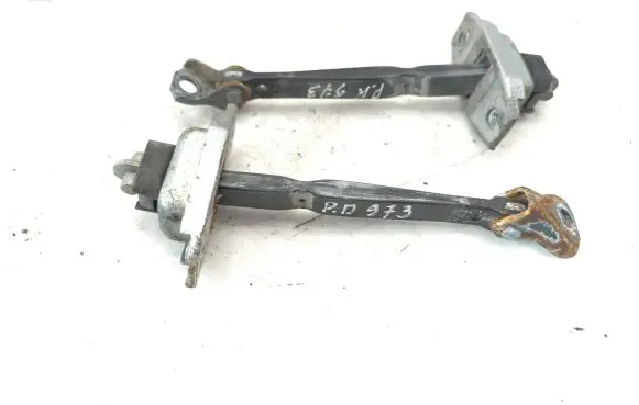 Front door check strap stopper