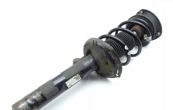 Volkswagen Golf VII Front shock absorber with coil spring 5Q0413031FH