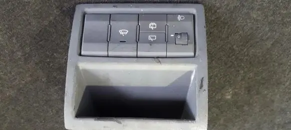 KIA Carens I Headlight level height control switch