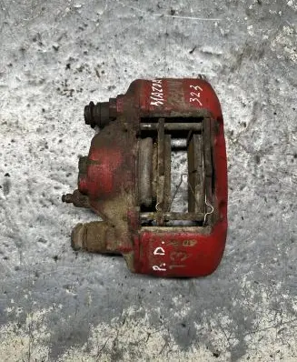 Mazda 323 F Front brake caliper