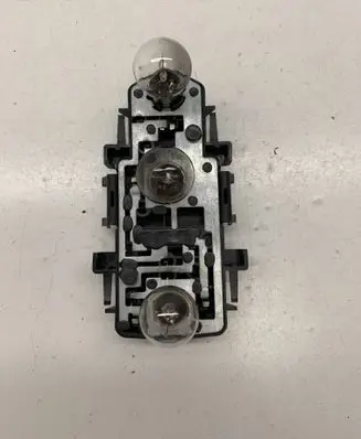 Tail light bulb cover holder