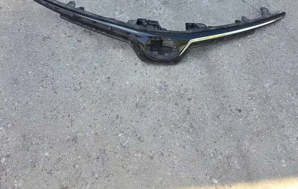 Toyota Corolla E210 E21 Front bumper upper radiator grill 5311102C90