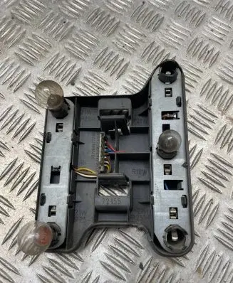 Tail light bulb cover holder