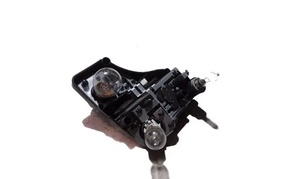 Tail light bulb cover holder
