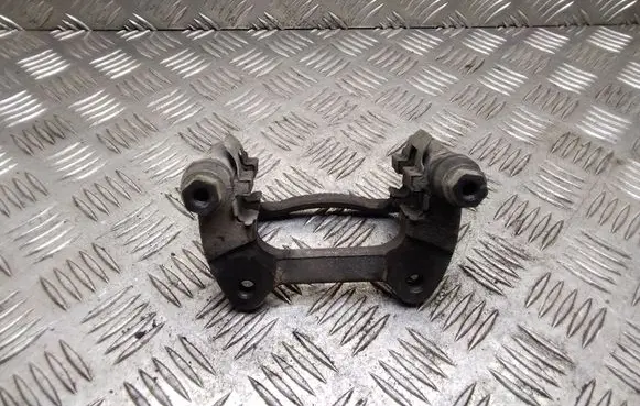 Mini One - Cooper Coupe R56 Brake caliper pad carrier rear 