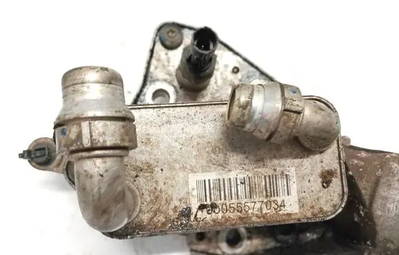 Opel Astra J Engine oil radiator 00055577034