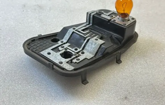Volkswagen Touareg I Tail light bulb cover holder 7L6945257