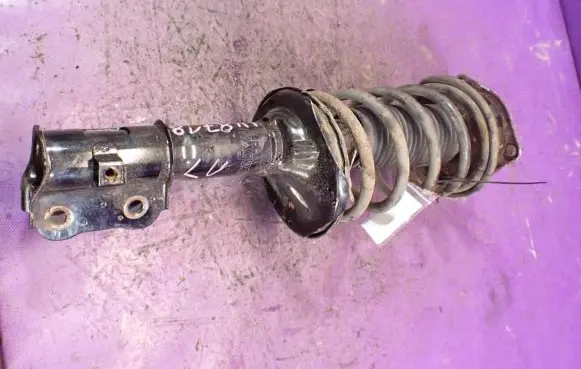 Hyundai Accent Front shock absorber with coil spring MGA5921