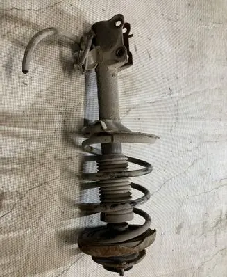 Nissan Almera Tino Front shock absorber with coil spring
