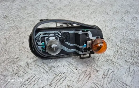 Tail light bulb cover holder