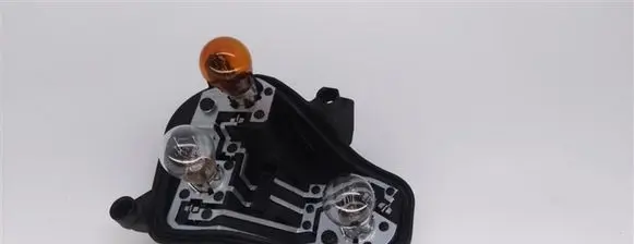 Tail light bulb cover holder