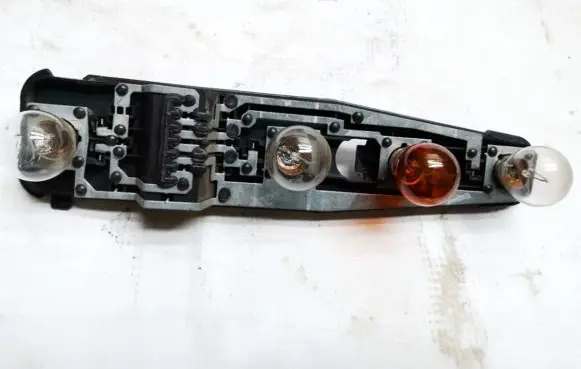 Tail light bulb cover holder