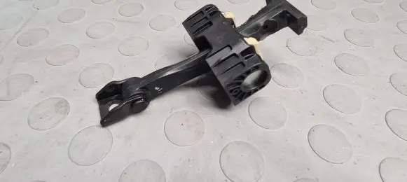 Front door check strap stopper