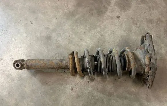 Nissan Primera Front shock absorber with coil spring