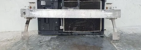 Radiator support slam panel