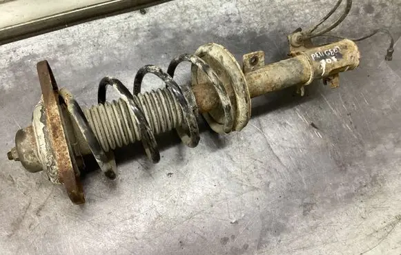 Front shock absorber with coil spring