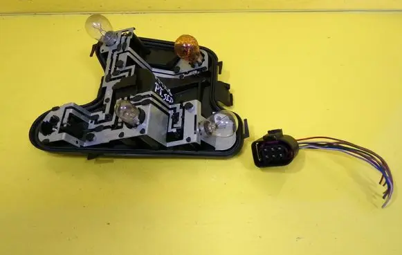 Tail light bulb cover holder