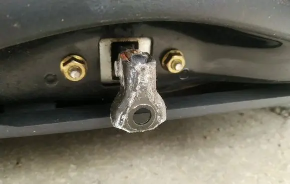 Front door check strap stopper