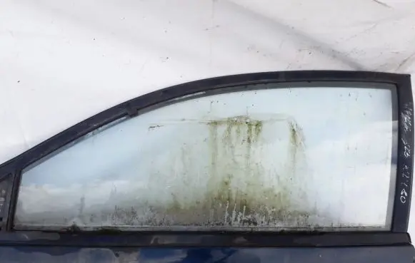 Mazda 323 Front door window glass four-door