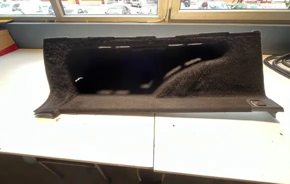 Trunk/boot lower side trim panel
