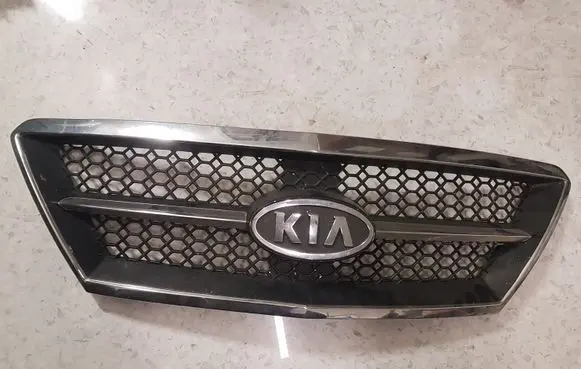 KIA Sorento Front bumper upper radiator grill 863503E010