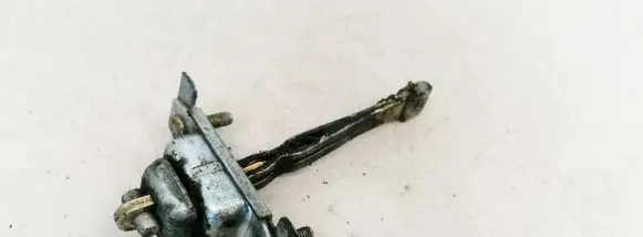 Mazda 323 F Front door check strap stopper 