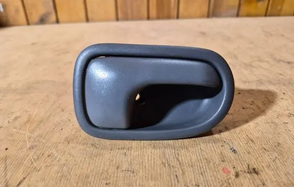 Mazda 323 Front door interior handle DH221