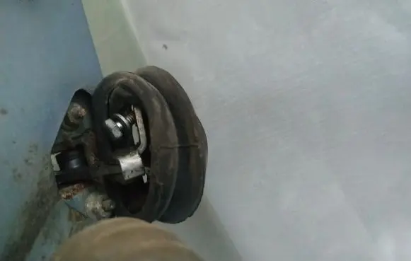Front door check strap stopper