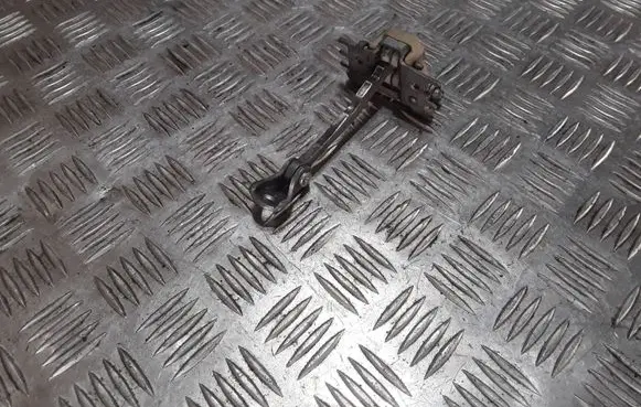 Front door check strap stopper