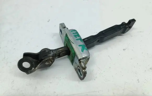 Front door check strap stopper