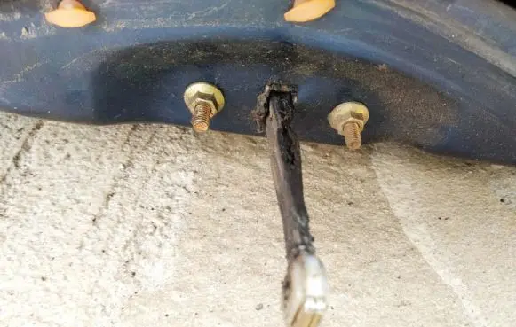 Front door check strap stopper