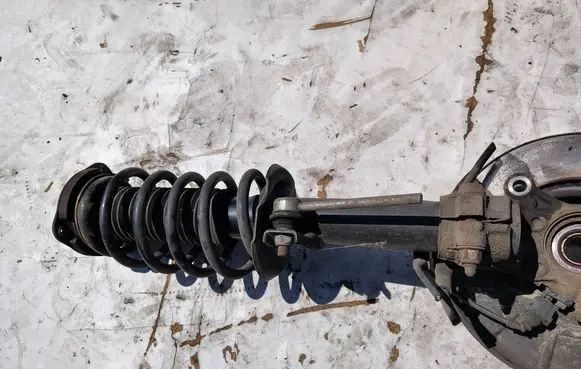 Volkswagen Caddy Front shock absorber with coil spring