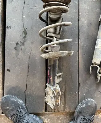 Front shock absorber with coil spring