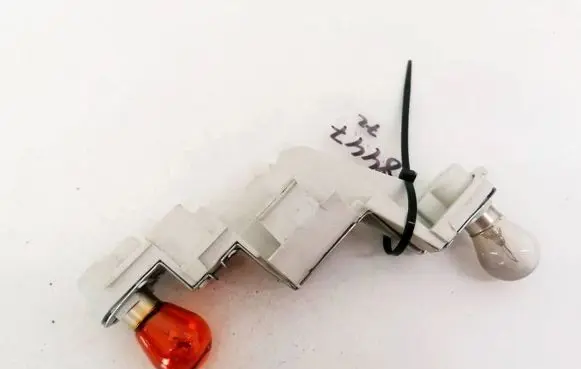 Volvo V50 Tail light bulb cover holder