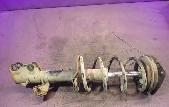 Front shock absorber with coil spring