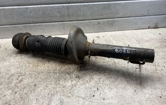 Volkswagen Golf IV Front shock absorber/damper 357413175A