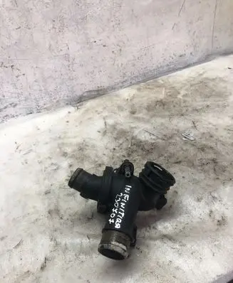 Thermostat/thermostat housing