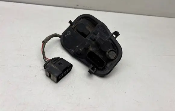 Tail light bulb cover holder