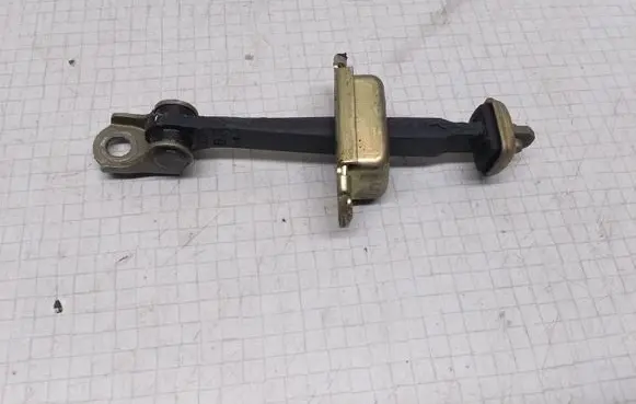 Nissan Primera Front door check strap stopper