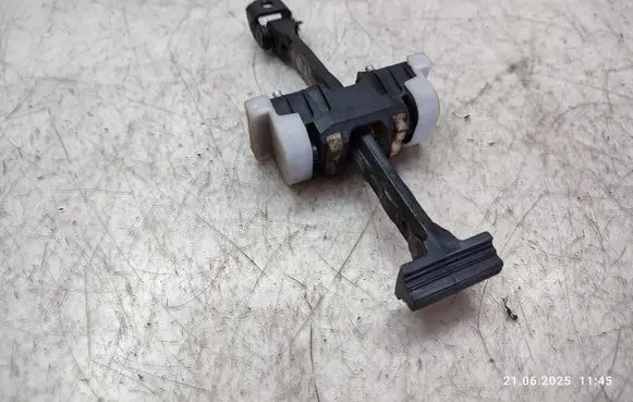 Front door check strap stopper