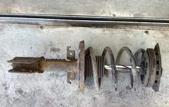Renault Megane III Front shock absorber with coil spring