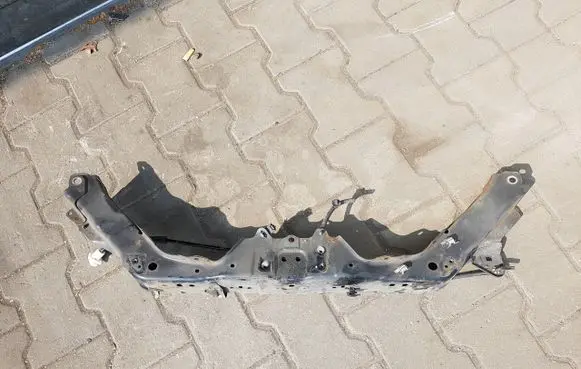 Top upper radiator support slam panel