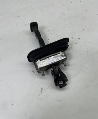 Front door check strap stopper