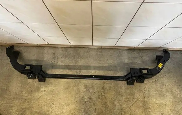 Top upper radiator support slam panel