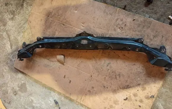 Top upper radiator support slam panel