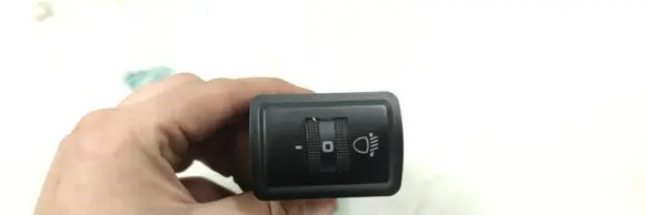 Headlight level height control switch